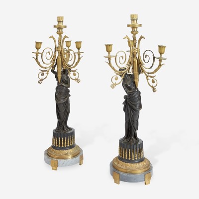 Lot 50 - A Pair of Louis XVI Style Gilt and Patinated Bronze Figural Four-Light Candelabra