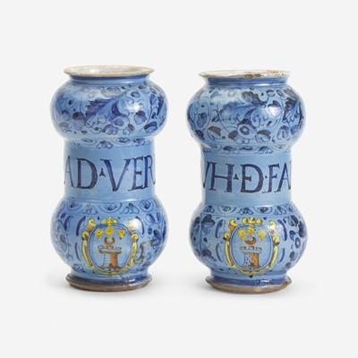 Lot 1 - A Pair of Italian Tin-Glazed Earthenware 'Berrettino' Armorial Albarelli