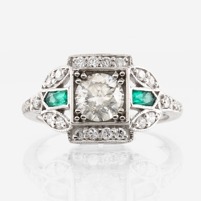 Lot 38 - A diamond, emerald, and white gold ring