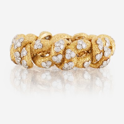 Lot 50 - A gold, diamond, and platinum bracelet