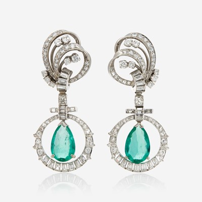 Lot 32 - A pair of emerald, diamond, and platinum pendant ear clips, Mauboussin