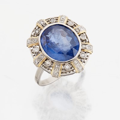 Lot 46 - A sapphire, diamond, gold, and platinum ring