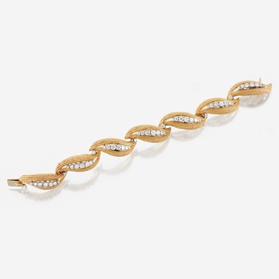 Lot 23 - A gold, platinum, and diamond bracelet, David Webb