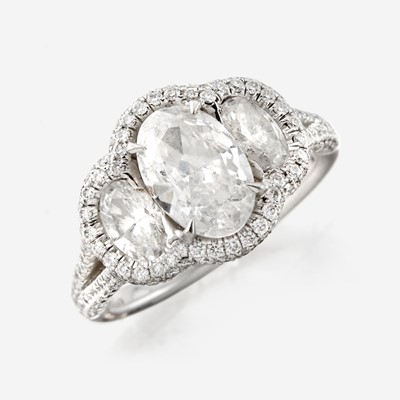 Lot 85 - A diamond and platinum ring, JB Star