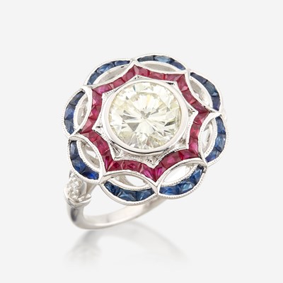 Lot 43 - A diamond, ruby, sapphire, and white gold ring