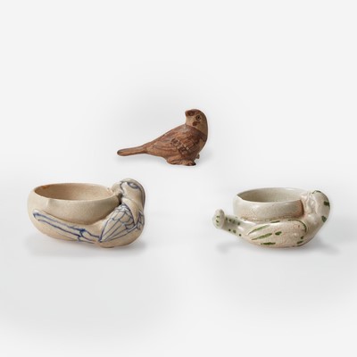 Lot 22 - A Vietnamese small figure of a bird and two small "Parrot and Peach" cups