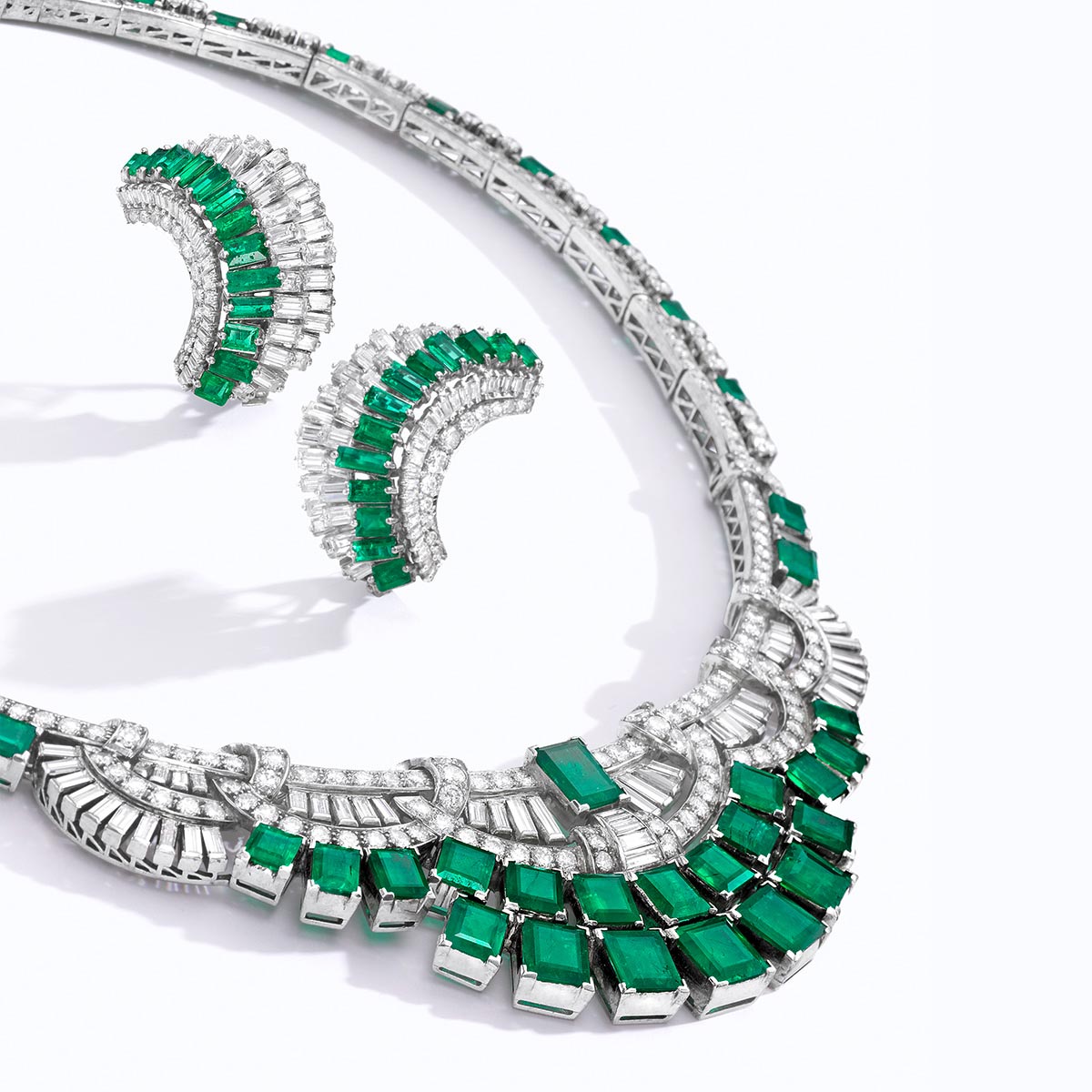 An emerald, diamond and platinum necklace and earrings